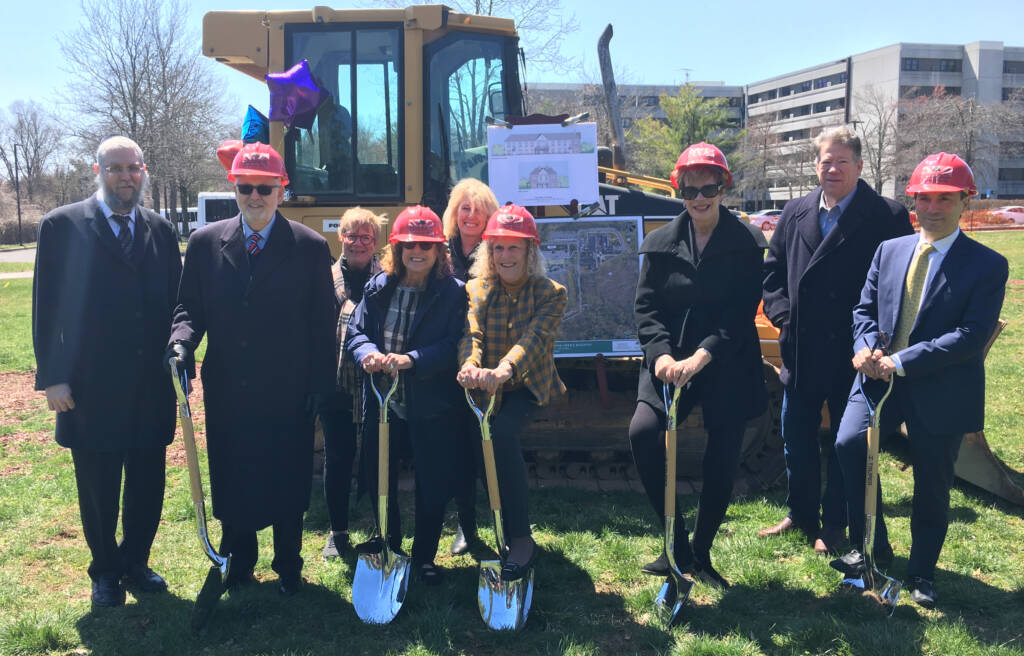 The Oscar and Ella Wilf Campus for Senior Living leaders smiling while holding shovel