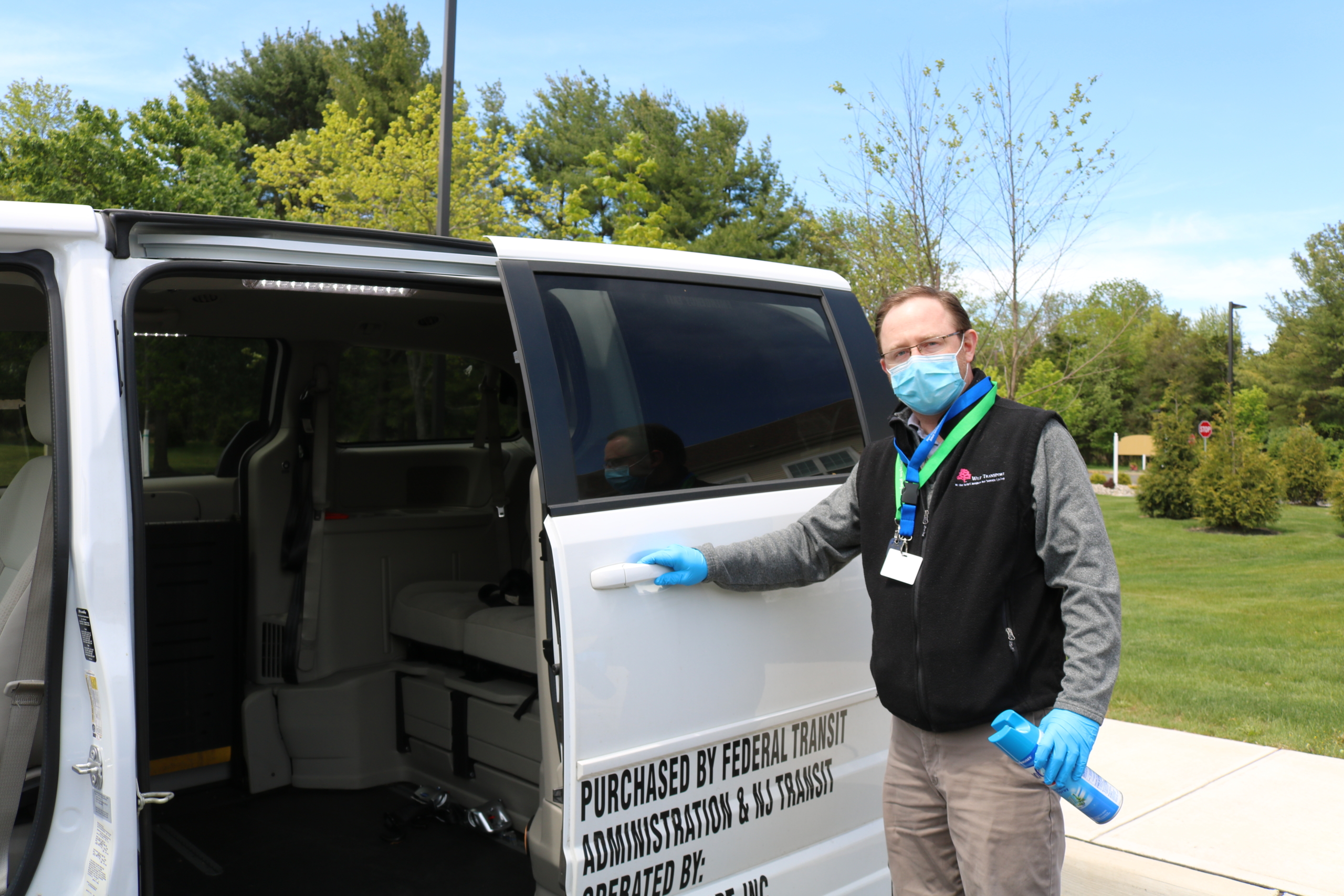 man opening door to van