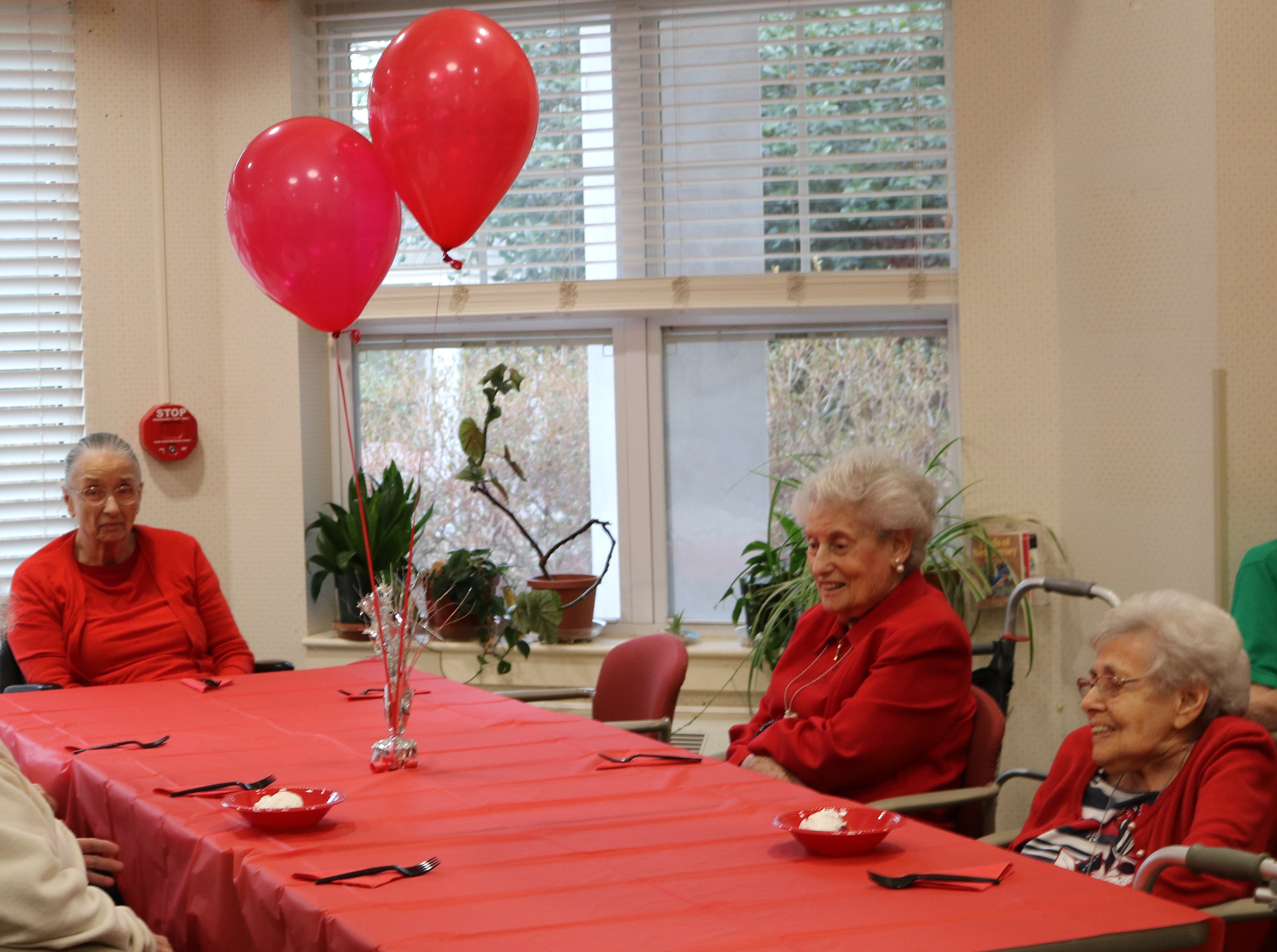 seniors dining wearing red